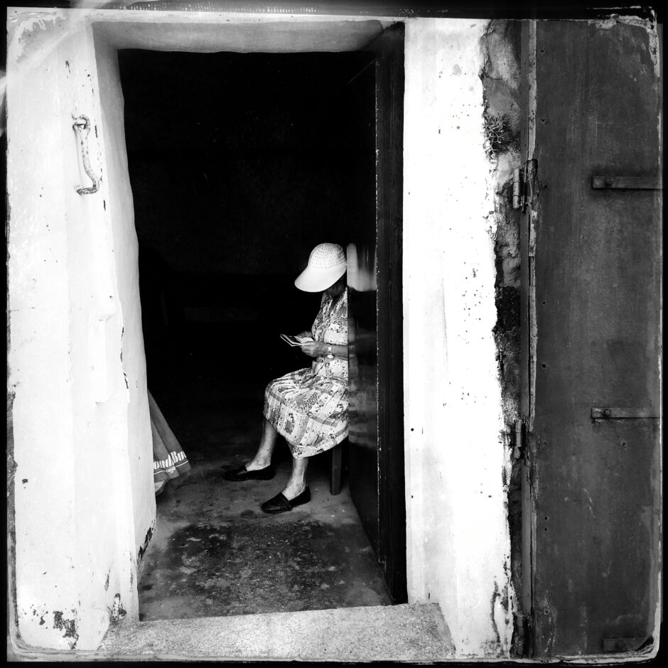 old woman in doorway